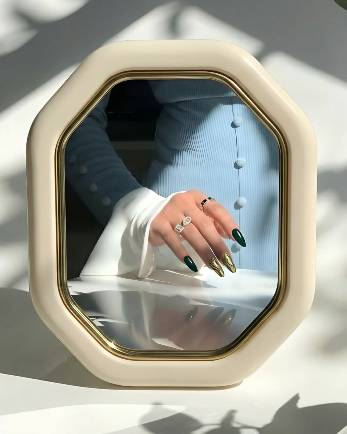 Nail detail reflected in a salon mirror